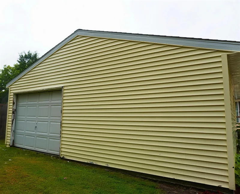 After: the garage siding clean and bright
