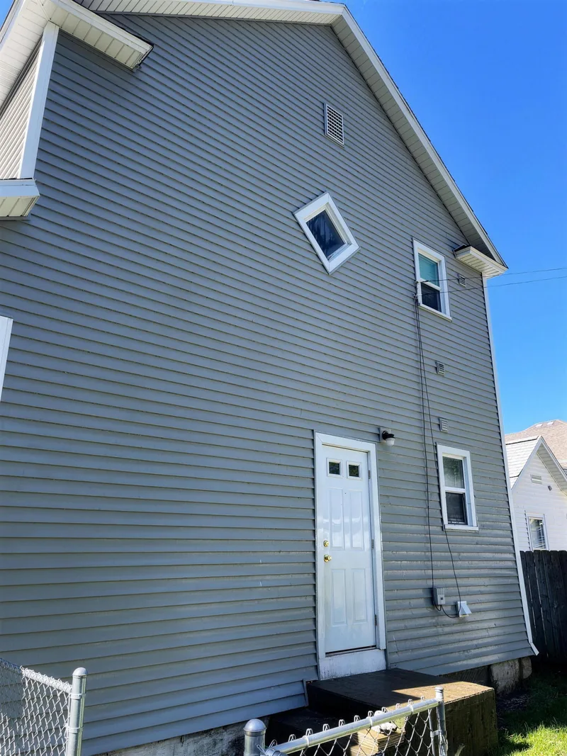 After: the same siding clean following a soft wash