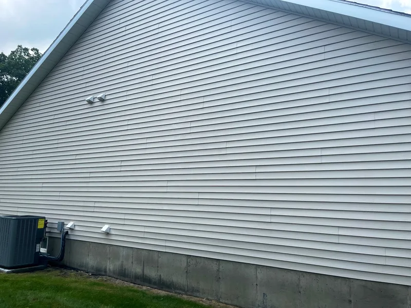 Tall vinyl siding wall clean after a soft wash near Fruitport